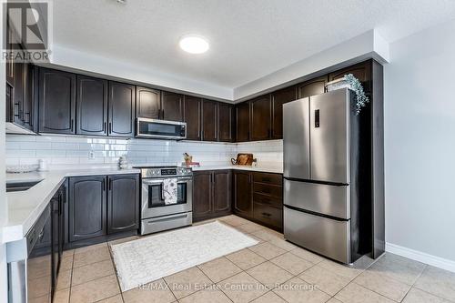 202 - 904 Paisley Road, Guelph (Parkwood Gardens), ON - Indoor Photo Showing Kitchen With Stainless Steel Kitchen With Double Sink With Upgraded Kitchen