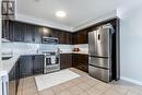 202 - 904 Paisley Road, Guelph (Parkwood Gardens), ON  - Indoor Photo Showing Kitchen With Stainless Steel Kitchen With Double Sink With Upgraded Kitchen 