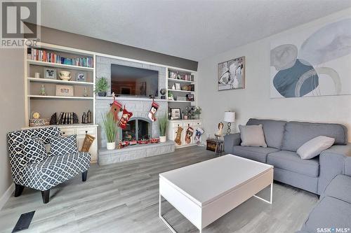 11 Forbes Place, Regina, SK - Indoor Photo Showing Living Room With Fireplace