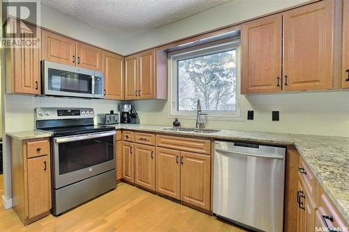 11 Forbes Place, Regina, SK - Indoor Photo Showing Kitchen With Double Sink