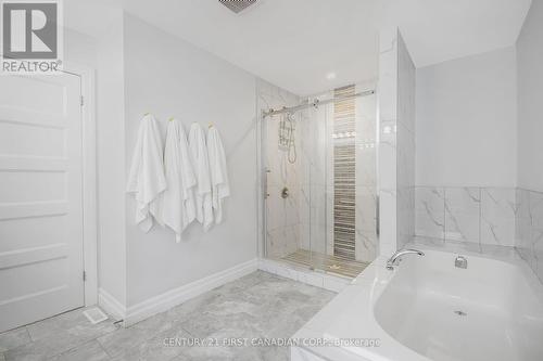 Primary Ensuite with Tiled Shower and Soaker Tub - 207 Union Avenue, Middlesex Centre (Komoka), ON - Indoor Photo Showing Bathroom