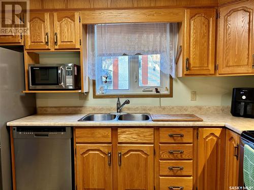 108 3120 Louise Street, Saskatoon, SK - Indoor Photo Showing Kitchen With Double Sink