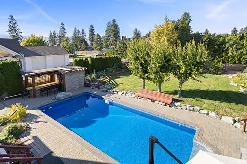 3374 Larkspur Court, Kelowna, BC - Outdoor With In Ground Pool With Deck Patio Veranda With Backyard