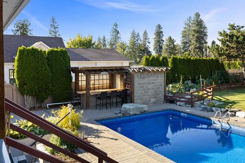 3374 Larkspur Court, Kelowna, BC - Outdoor With In Ground Pool With Deck Patio Veranda With Backyard