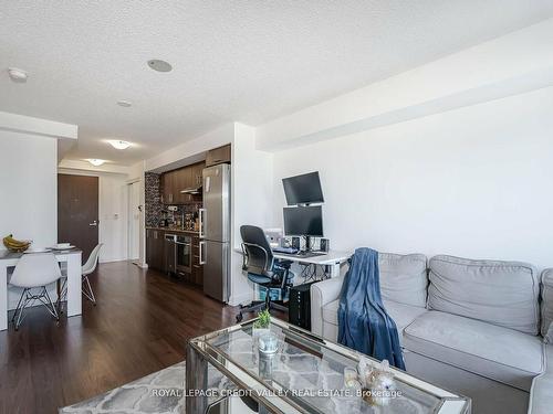 1307-255 Village Green Sq, Toronto, ON - Indoor Photo Showing Living Room