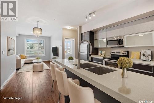 214 225 Maningas Bend, Saskatoon, SK - Indoor Photo Showing Kitchen With Stainless Steel Kitchen With Double Sink With Upgraded Kitchen