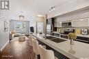 214 225 Maningas Bend, Saskatoon, SK  - Indoor Photo Showing Kitchen With Stainless Steel Kitchen With Double Sink With Upgraded Kitchen 