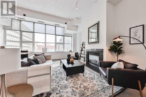 447 - 155 Dalhousie Street, Toronto, ON - Indoor Photo Showing Living Room With Fireplace