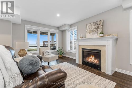 28 Pierre Trudeau Lane, Grimsby, ON - Indoor Photo Showing Living Room With Fireplace