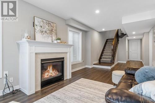 28 Pierre Trudeau Lane, Grimsby, ON - Indoor Photo Showing Living Room With Fireplace