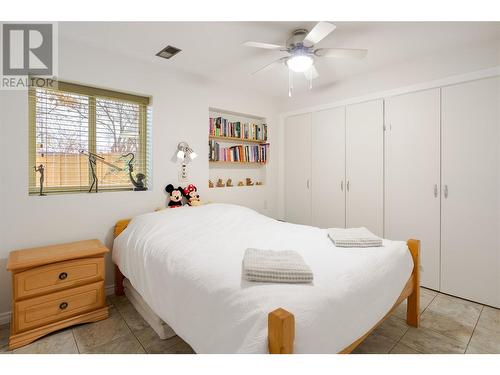 Main floor bedroom with convenient access to the main floor full bathroom - 600 Welke Road, Kelowna, BC - Indoor Photo Showing Bedroom