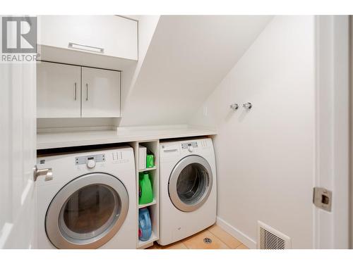 Walk-in laundry room with storage - 600 Welke Road, Kelowna, BC - Indoor Photo Showing Laundry Room