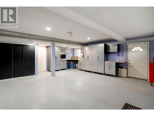 Large garage with epoxy flooring, and storage - 600 Welke Road, Kelowna, BC - Indoor