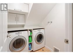 Walk-in laundry room with storage - 