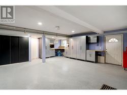 Large garage with epoxy flooring, and storage - 