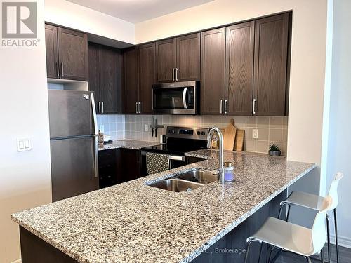 718 - 349 Rathburn Road W, Mississauga, ON - Indoor Photo Showing Kitchen With Stainless Steel Kitchen With Double Sink With Upgraded Kitchen