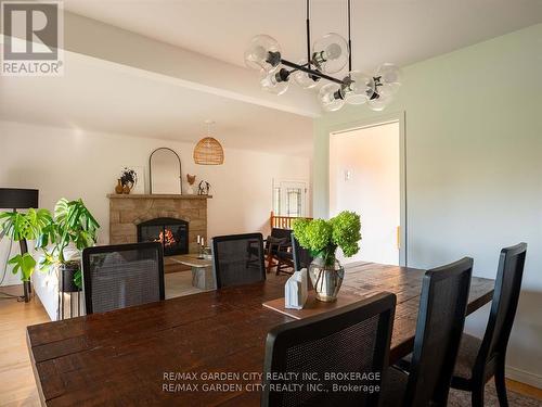 15 Rosemount Avenue, St. Catharines (442 - Vine/Linwell), ON - Indoor Photo Showing Dining Room With Fireplace