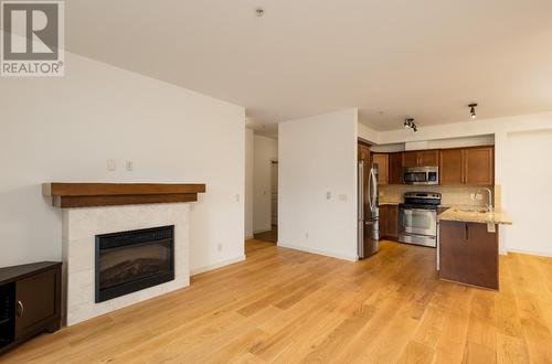 2142 Vasile Road Road Unit# 313, Kelowna, BC - Indoor With Fireplace