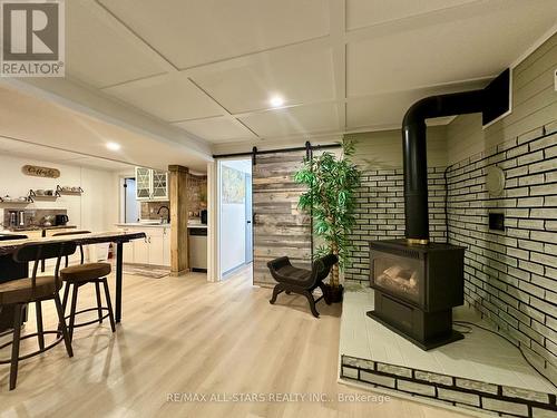 35 Cedartree Lane, Kawartha Lakes (Bobcaygeon), ON - Indoor Photo Showing Other Room With Fireplace