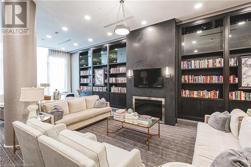 LIBRARY - 11 Bronte Road Unit# 503, Oakville, ON - Indoor Photo Showing Living Room With Fireplace