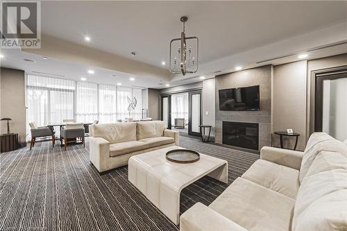 PARTY ROOM - 11 Bronte Road Unit# 503, Oakville, ON - Indoor Photo Showing Living Room With Fireplace