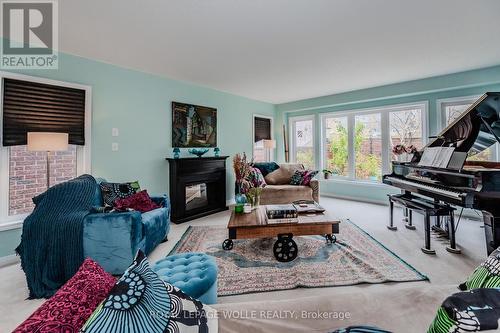 565 Sundew Drive, Waterloo, ON - Indoor Photo Showing Living Room With Fireplace