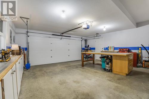 Spacious Garage Great for a Workshop or Keeping The Cars Warm - 3556 Athalmer Road, Kelowna, BC - Indoor Photo Showing Garage