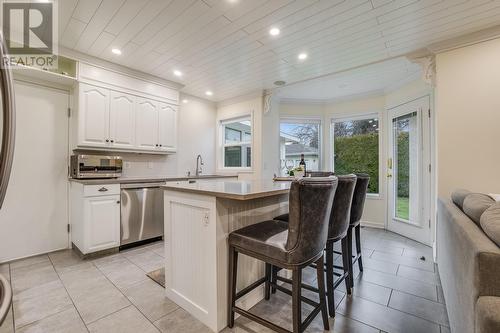 Main Home Kitchen With Stainless Steel Appliances - 3556 Athalmer Road, Kelowna, BC - Indoor