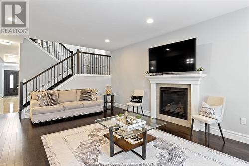 6268 Disputed, Lasalle, ON - Indoor Photo Showing Living Room With Fireplace