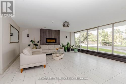 1206 - 1100 Caven Street, Mississauga, ON - Indoor Photo Showing Living Room With Fireplace