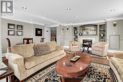 807 - 3000 Creekside Drive, Hamilton, ON - Indoor Photo Showing Living Room With Fireplace