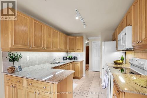 807 - 3000 Creekside Drive, Hamilton, ON - Indoor Photo Showing Kitchen With Double Sink