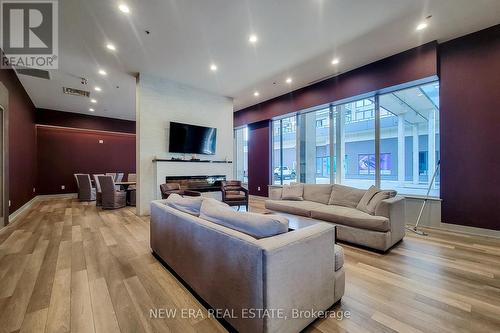 605 - 560 North Service Road, Grimsby, ON - Indoor Photo Showing Living Room With Fireplace