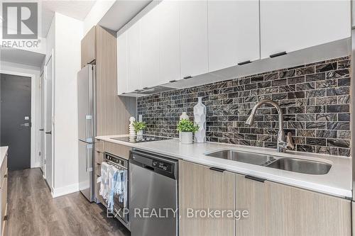 312 - 5220 Dundas Street, Burlington, ON - Indoor Photo Showing Kitchen With Double Sink