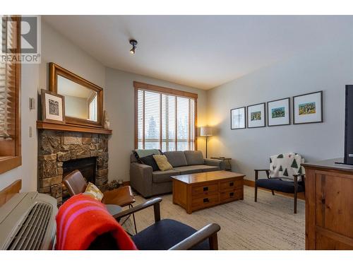 4559 Timberline Crescent Unit# 427, Fernie, BC - Indoor Photo Showing Living Room With Fireplace