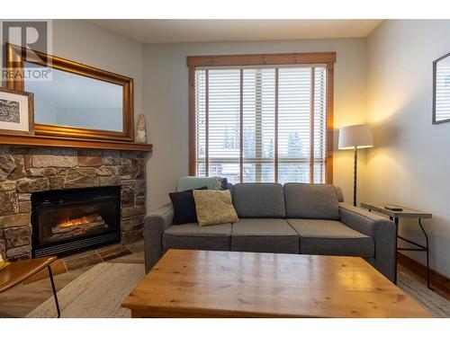 4559 Timberline Crescent Unit# 427, Fernie, BC - Indoor Photo Showing Living Room With Fireplace