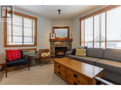 4559 Timberline Crescent Unit# 427, Fernie, BC - Indoor Photo Showing Living Room With Fireplace