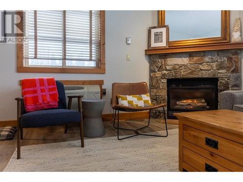 4559 Timberline Crescent Unit# 427, Fernie, BC - Indoor Photo Showing Living Room With Fireplace