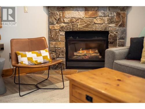 4559 Timberline Crescent Unit# 427, Fernie, BC - Indoor Photo Showing Living Room With Fireplace