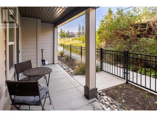 Main floor with landscaping and direct access to the exterior - 655 Academy Way Unit# 107, Kelowna, BC - Outdoor With Deck Patio Veranda With Exterior