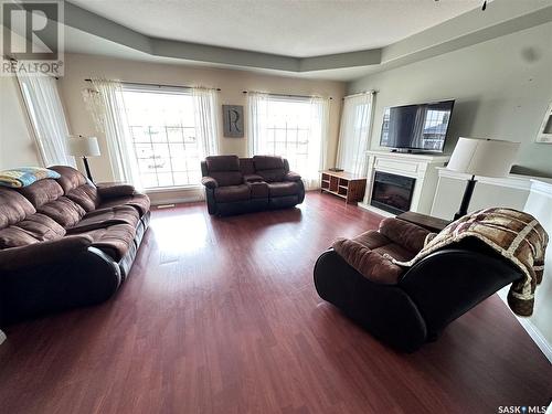 304 Abbott Bay, Estevan, SK - Indoor Photo Showing Living Room With Fireplace