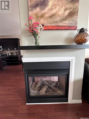 304 Abbott Bay, Estevan, SK - Indoor Photo Showing Living Room With Fireplace