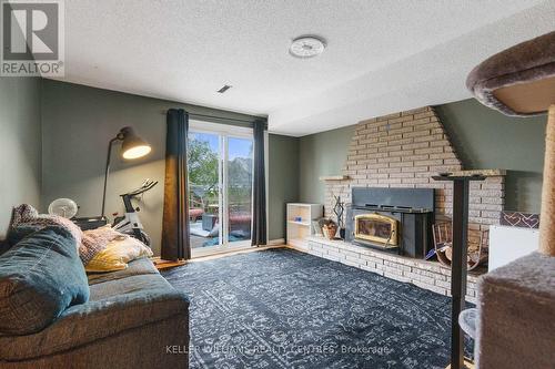 16 Gosney Crescent W, Barrie, ON - Indoor Photo Showing Living Room With Fireplace