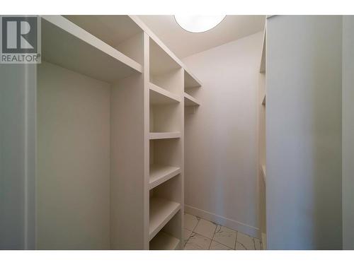 Primary Walk In Closet - 9723 Centrestone Drive, Lake Country, BC - Indoor With Storage