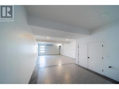 Tandem Garage Area - 9723 Centrestone Drive, Lake Country, BC - Indoor Photo Showing Other Room