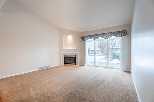 18-650 Harrington Road, Kamloops, BC - Indoor Photo Showing Other Room With Fireplace