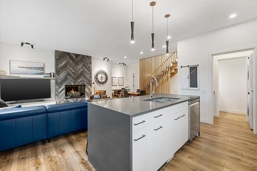 2-1053 Martin Avenue, Kelowna, BC - Indoor Photo Showing Kitchen With Fireplace With Double Sink