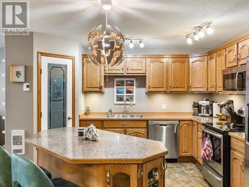 17 Skookum Drive, Whitehorse, YT - Indoor Photo Showing Kitchen With Double Sink