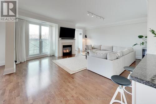 313 - 20 Scrivener Square, Toronto, ON - Indoor Photo Showing Living Room With Fireplace