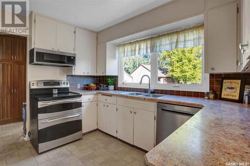 918 Henry Street, Moose Jaw, SK - Indoor Photo Showing Kitchen With Double Sink